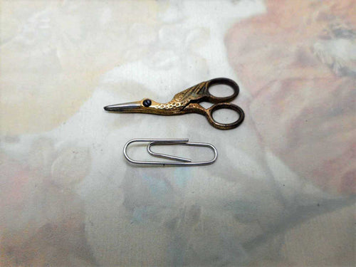 A tiny pair of gilt steel stork scissors. 20thc Doll / Toy