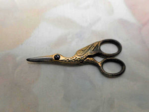 A tiny pair of gilt steel stork scissors. 20thc