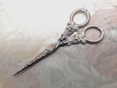 A pair of silver handled scissors with blade sheath. c 1835