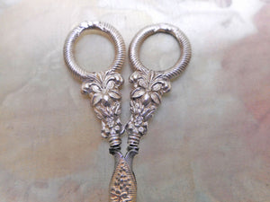 A fine pair of silver handled scissors with blade sheath. c1835
