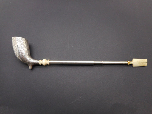 An engraved silver pipe. George Unite 1861