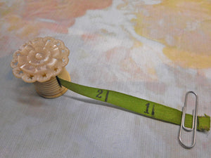 A tape measure from a Victorian sewing box. c 1850 -new printed ribbon.