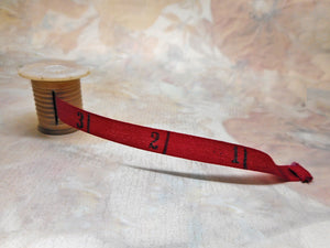 SOLD......A pearl topped tape measure.* replacement printed silk ribbon*. c1850