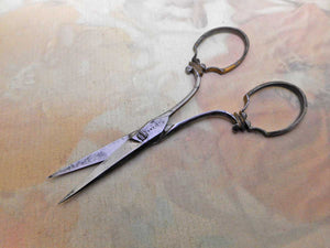 A pair of fancy steel scissors. Preist maker.