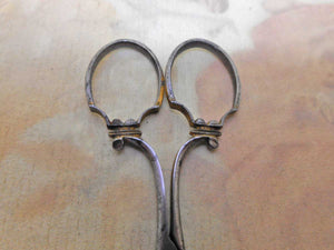 A pair of fancy steel scissors. Preist maker.