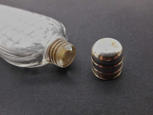 A cut glass scent bottle with silver lid. Georgian. c1830