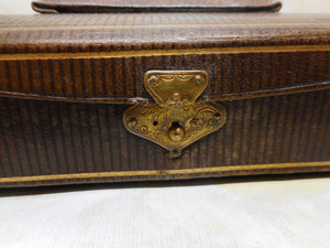 A small leather etui with steel sewing tools. c 1880