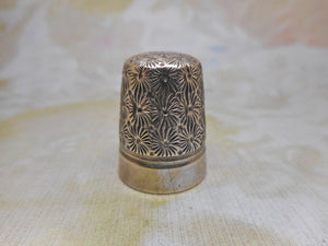 A Dorcas thimble. Size 6.