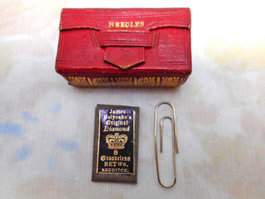 A little red leather needle case in the form of a book. c 1800-1815