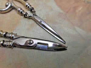 Two pairs of silver handled scissors. B'ham 1900