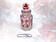 Load image into Gallery viewer, A small glass smelling salts bottle with vine decoration.
