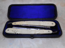 Load image into Gallery viewer, A cased pair of bone razors with silver pique decoration. c1880
