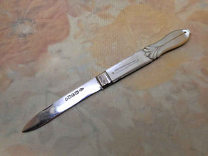 SOLD.....A mother of pearl folding fruit knife. Hall marked 1849.