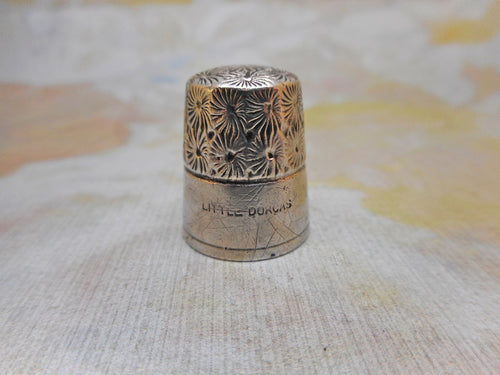 A decorative 'Little Dorcas' thimble. c1900