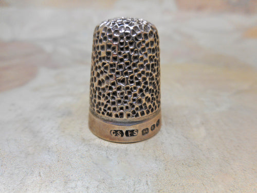 A hall marked silver thimble from a chatelaine. CS*FS maker 1912.