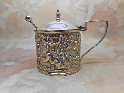 A sterling silver mustard pot in its presentation box. B'ham 1904