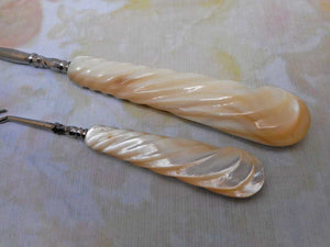 A pair of mother of pearl handled button hooks.  c1900-1920.