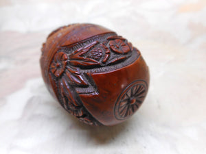 A good quality carved coquilla nut egg pomander. c 1850