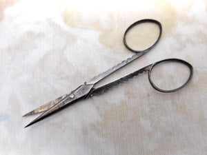 A pair of decorative steel sewing scissors. 19thc.