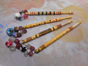 Four decorated 19th century bone lace bobbins.