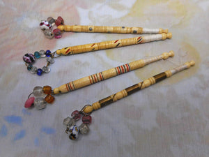 Four decorative Victorian bone lace bobbins.