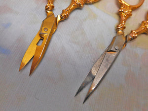 SOLD……Two pairs of 9 carat gold handled scissors. HM. 1898