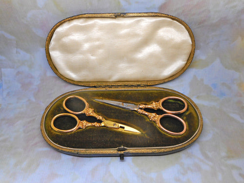 Two pairs of antique 9 carat gold handled scissors. HM. 1898