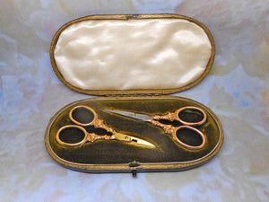 Two pairs of antique 9 carat gold handled scissors. HM. 1898