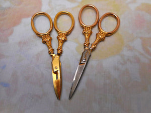 SOLD……Two pairs of 9 carat gold handled scissors. HM. 1898