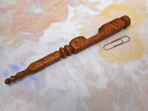 A chip carved knitting stick for a child. 19thc