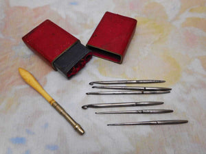 SOLD…..       A crochet hook set in a red leather case. c 1850