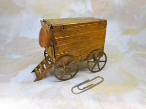 A novelty pressed brass Bathing Machine needle case