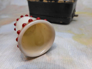 SOLD…….A 19th century porcelain thimble with red 'jewels'.