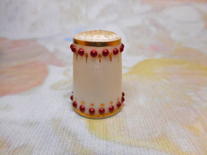 SOLD…….A 19th century porcelain thimble with red 'jewels'.