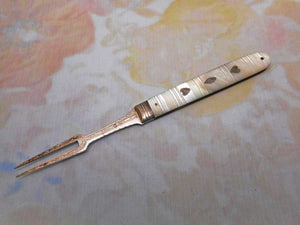 SOLD……An engraved mother pf pearl folding fruit fork. c 1800