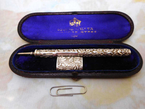 A fine quality silver propelling pencil and leads case. Asprey & Son.