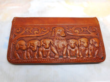 Load image into Gallery viewer, A charming tan leather stamp / card case embossed with a row of hounds.
