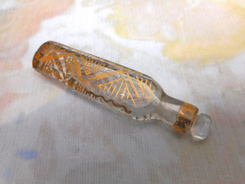 A small glass tear catcher scent bottle with gilding. Late Victorian.