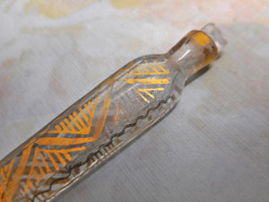 A small glass tear catcher scent bottle with gilding. Late Victorian.