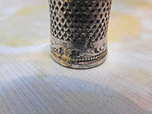 SOLD…….A late 17th century silver thimble. Maker AP conjoined.