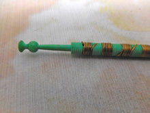 Load image into Gallery viewer, A vibrant green lace bobbin with brass wiring. c 1850
