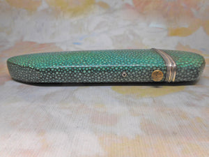 A shagreen spectacle case fitted with silver eye glasses. HM 1812.