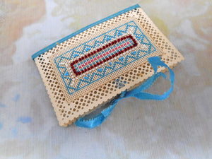 A super bead work and cross stitched needle case / book. c 1840