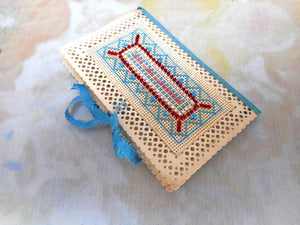 A super bead work and cross stitched needle case / book. c 1840