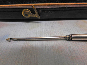 A silver crochet hook holder with two hooks and original case. c1880