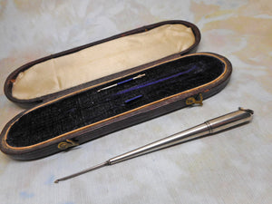 A silver crochet hook holder with two hooks and original case. c1880