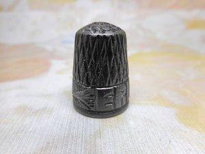 An Irish bog oak thimble. c 1880