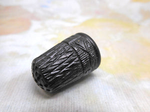 An Irish bog oak thimble. c 1880