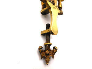 A figural hemming clamp. c1880-1900