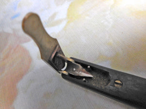 A wooden mechanical quill cutter. c1850